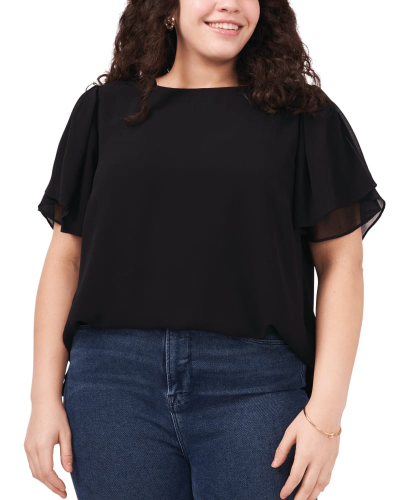 Front of a model wearing a size 1X Bella Ruffle Sleeve Blouse in RICH BLACK by Vince Camuto. | dia_product_style_image_id:260840